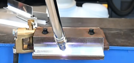 Cobot welding torch in operation
