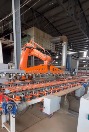 Retrofit robot on an automated tile and stone processing line